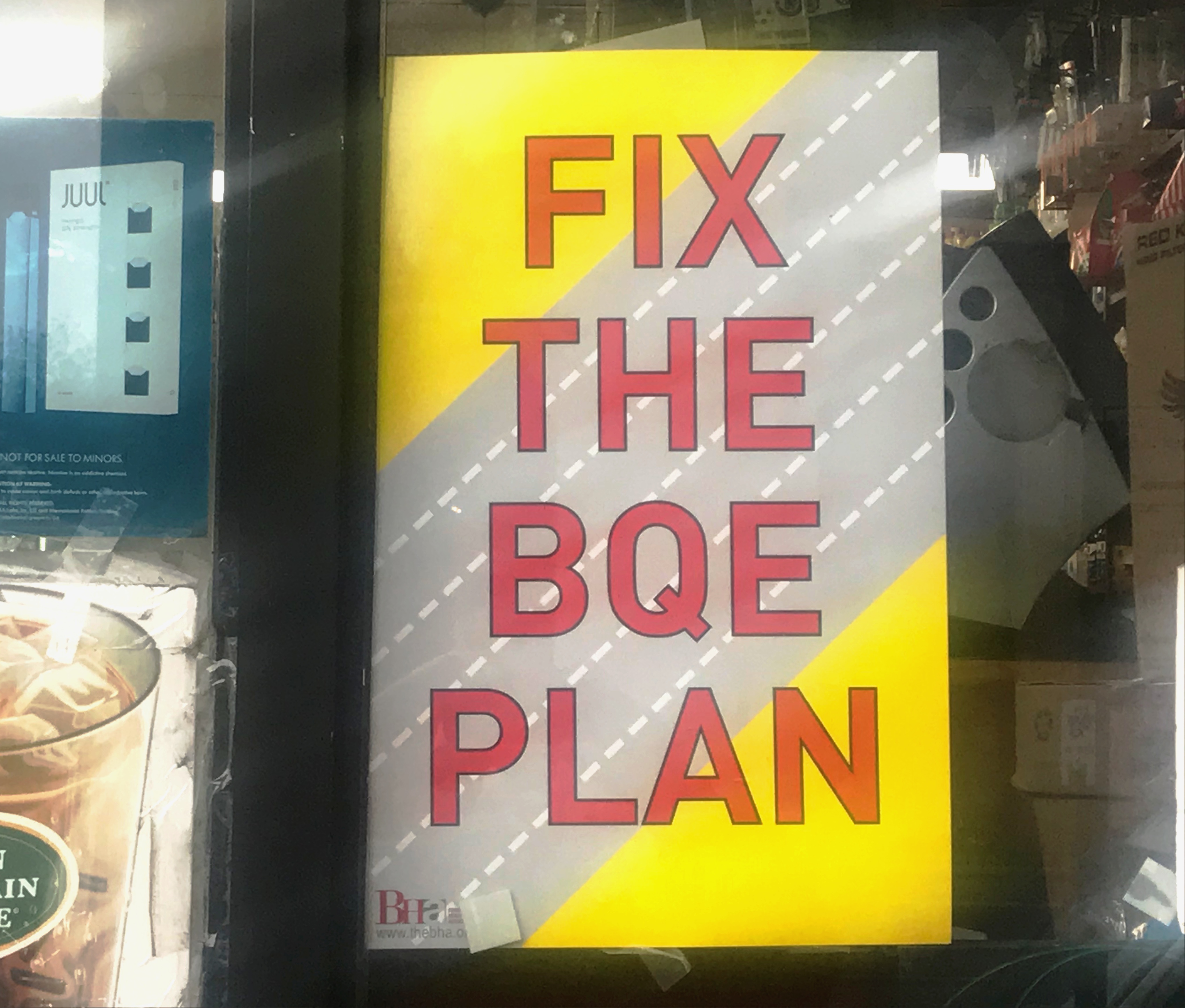 Fix the BQE sign in shop window